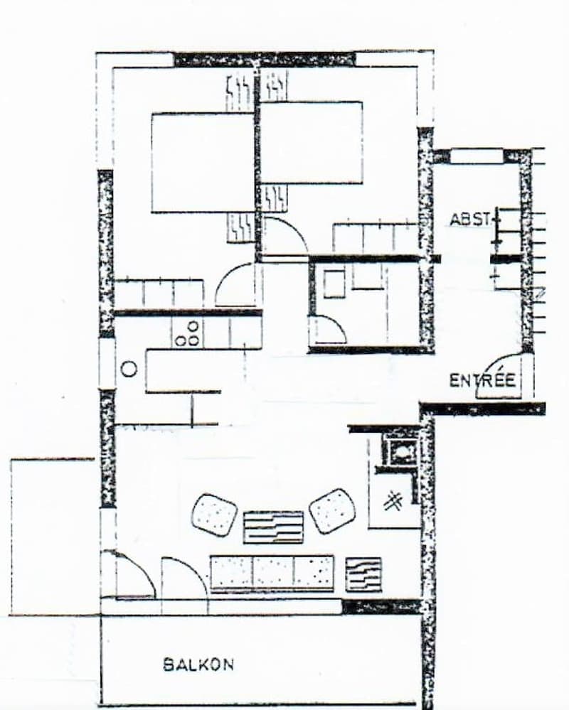 Floor plan of a house showing a living room, kitchen, bedroom, bathroom, and entrance area.