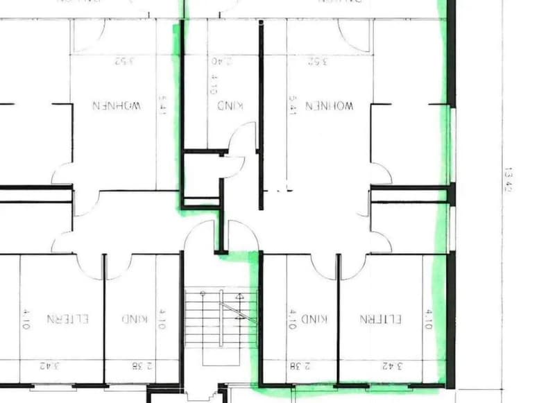 Floor plan of a house with two bedrooms, a living room, a kitchen, and a bathroom.