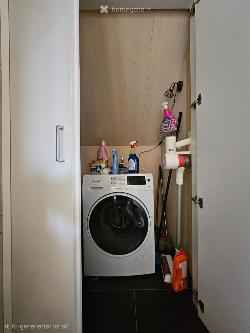 Laundry area with a white Siemens washing machine, cleaning supplies, and a small shelf holding additional items.