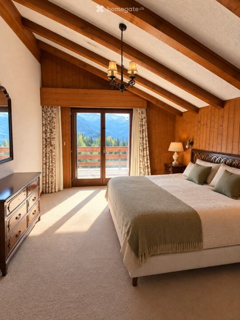 Cozy attic bedroom with wooden beams, large window offering mountain view, bed with green pillows and blanket, nightstand with lamp, dresser, and chandelier.