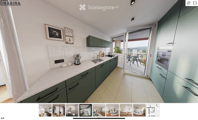 Modern kitchen with green cabinets, white tiled backsplash, and a large window opening to a balcony. Features include a sink, coffee maker, and framed pictures on the wall.