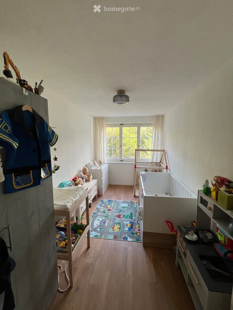 {"type": "Furnished Room", "objects": ["bed", "toy car track", "cupboard", "stool", "table", "chair", "fridge", "microwave", "fridge", "cupboard", "stool", "stool", "stool", "stool", "stool", "stool", "stool", "stool", "stool", "stool", "stool", "stool",