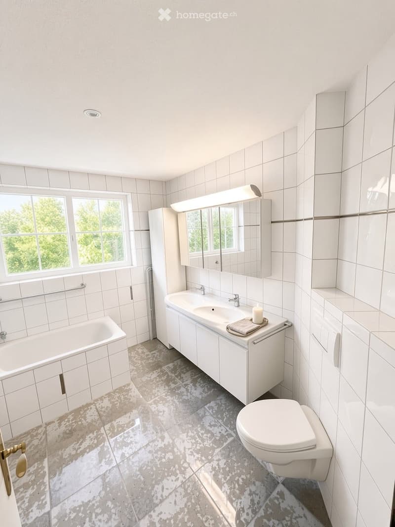Bright bathroom with white tiles, a bathtub, a sink with a mirror, a toilet, and a window offering a view of greenery outside.