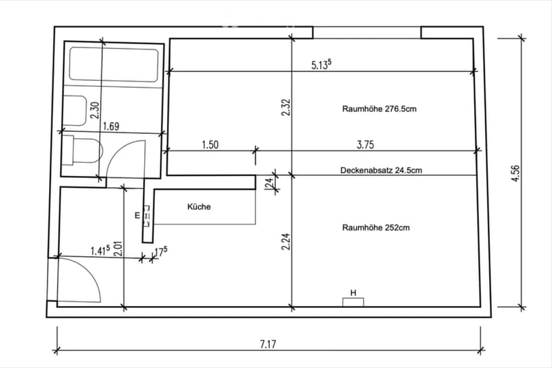 Floor plan showing a kitchen and living area with labeled dimensions and room heights.