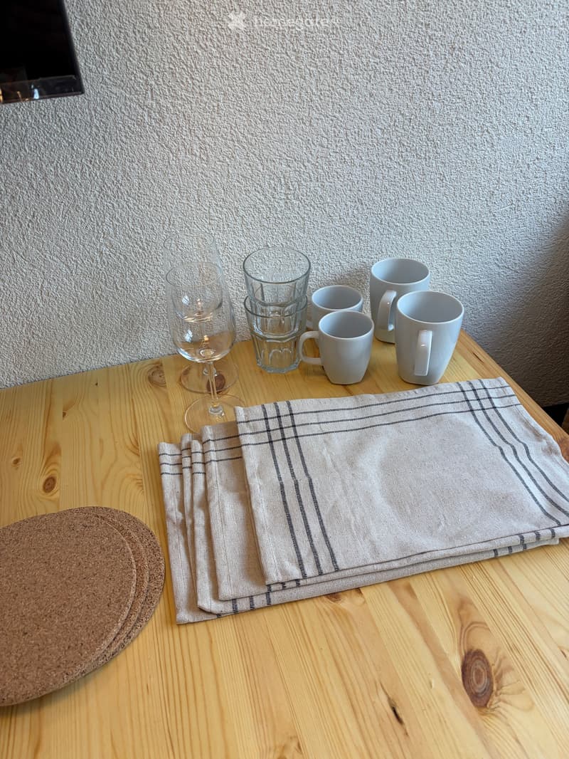 Table, cups, wine glass, napkins
