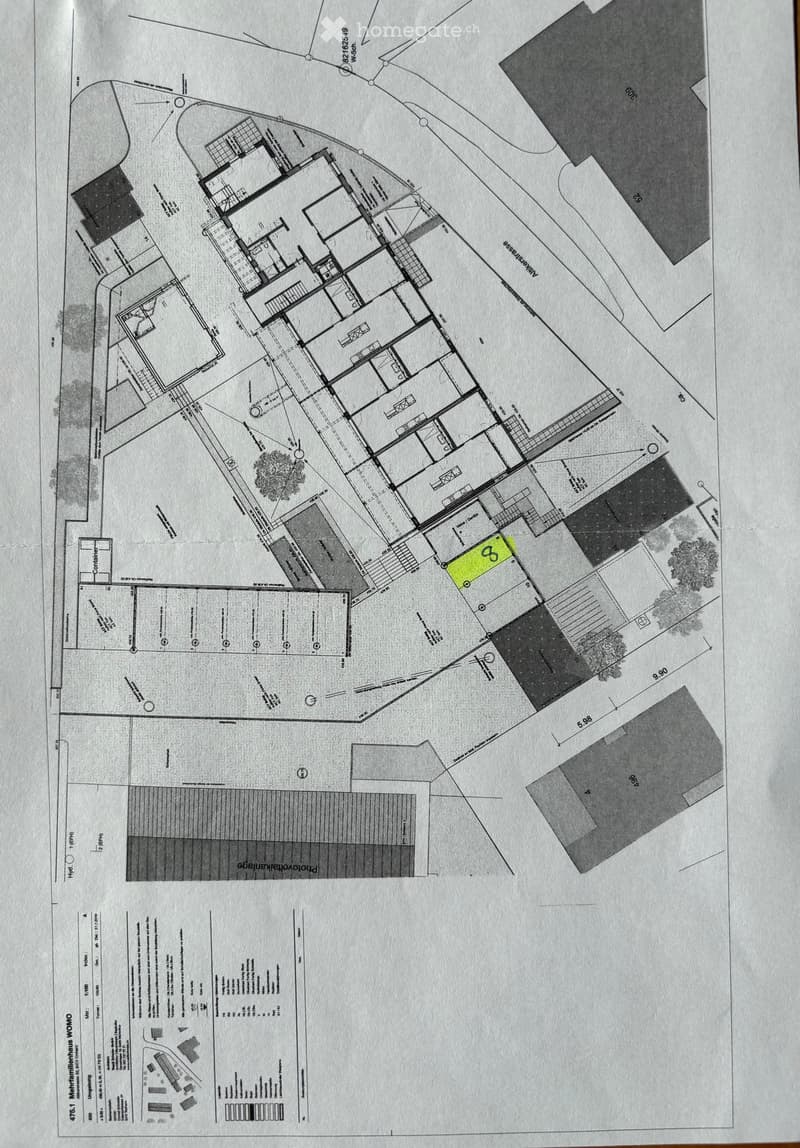 Floor plan of a multi-building complex with detailed layout, including labeled areas, pathways, and measurements.