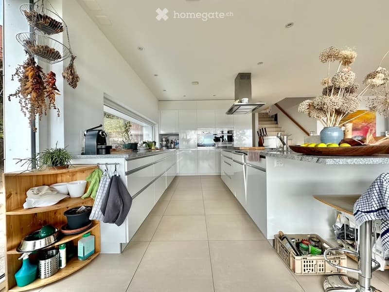 {"type": "Kitchen", "objects": ["kitchen island", "wooden shelf", "faucet", "coffee maker", "bowl", "vase", "stool", "cushion", "faucet", "oven", "cupboard", "stool", "faucet", "oven", "cupboard", "stool", "stool", "stool", "stool", "stool", "stool", "sto