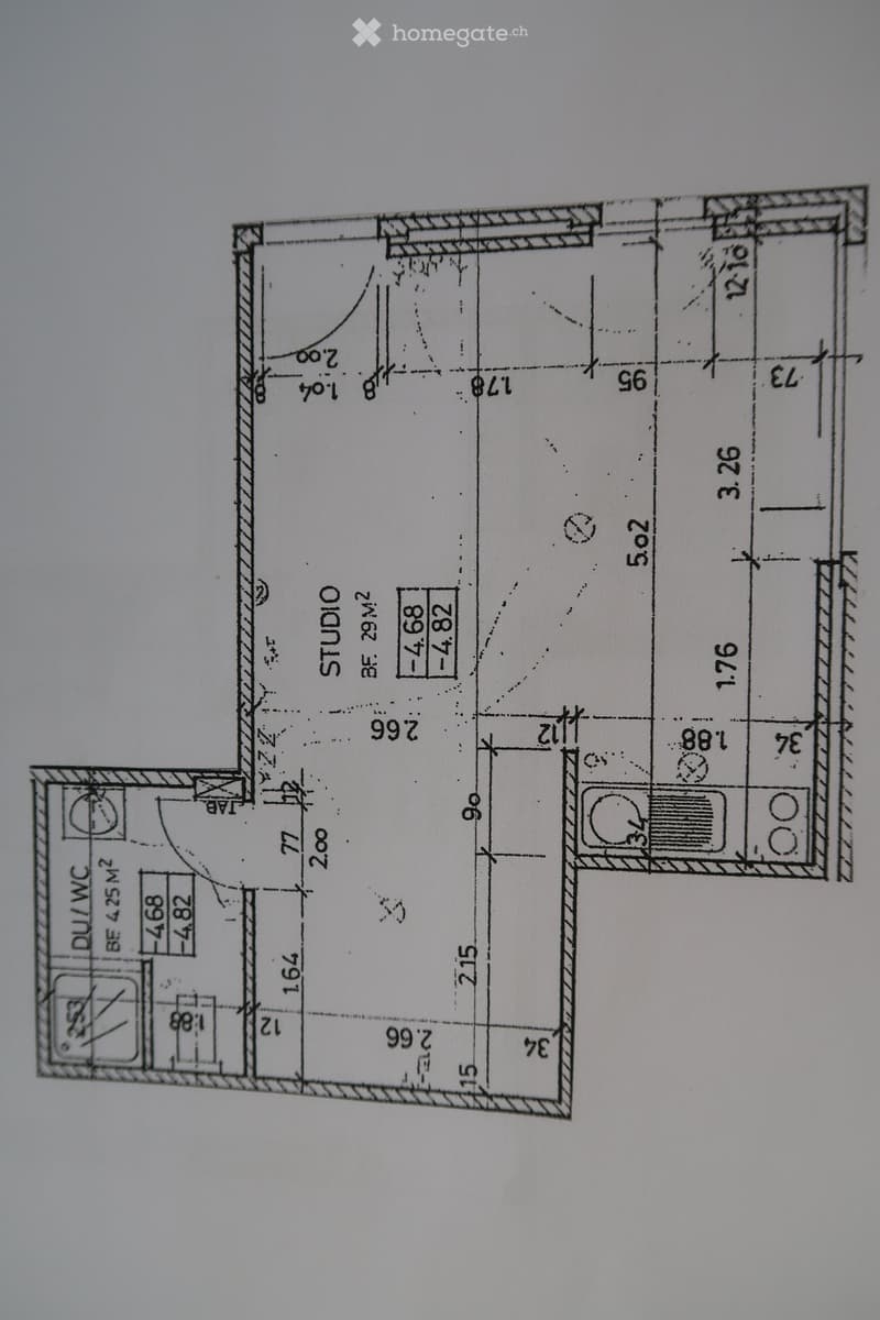 Floor plan showing a studio, bathroom, and living area with dimensions and room labels.