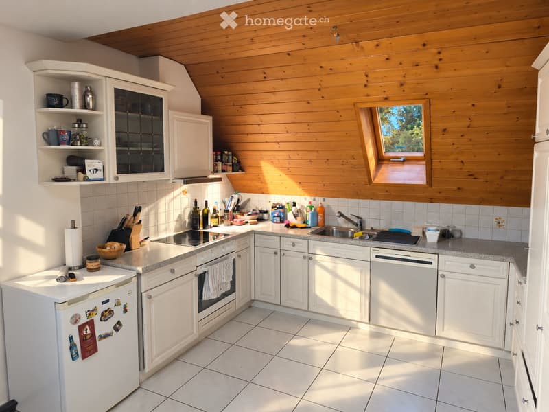 {"type": "Kitchen", "objects": ["refrigerator", "oven", "sink", "faucet", "cabinets", "countertop", "knife block", "wine bottles", "cupboard", "bowl", "fridge magnets", "cup", "bottle", "cupboard", "cupboard", "cupboard", "cupboard", "cupboard", "cupboard
