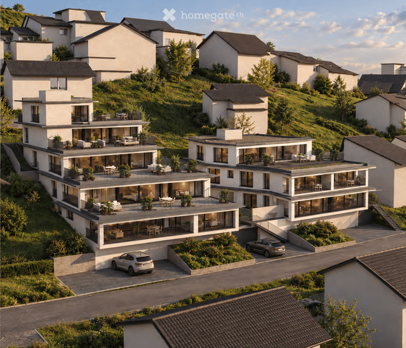 Aerial view of a modern residential complex with multiple two-story houses, balconies, terraces, and landscaped gardens.
