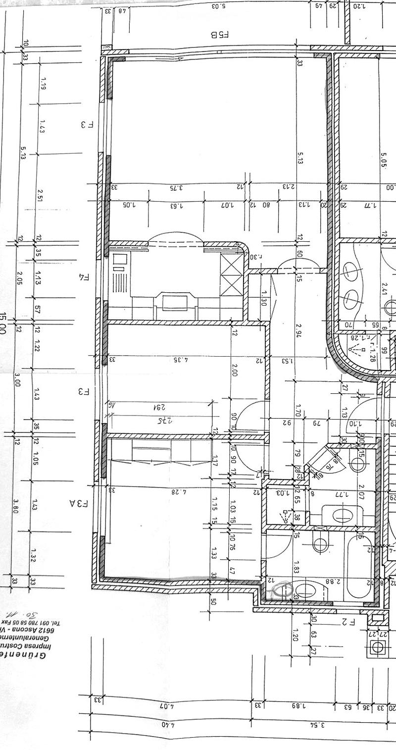 Floor plan of a residential space with labeled dimensions, including a living area, kitchen, bedrooms, and bathrooms.