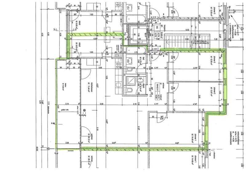 Floor plan of a residential building showing multiple rooms, including living areas, bedrooms, bathrooms, and a kitchen, with detailed measurements and room labels.