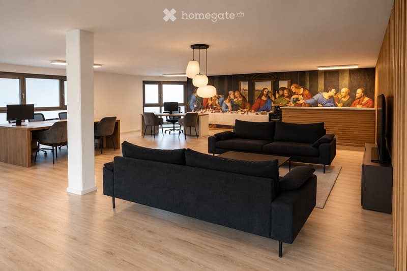 Modern living room with a large sofa, coffee table, and a dining area with a long table and chairs. The room features large windows, pendant lights, and a large artwork on the wall.