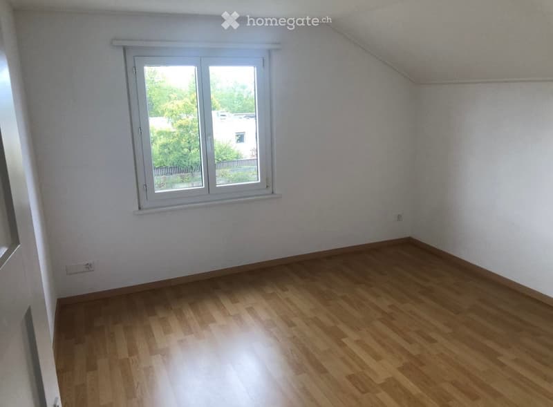 Completely empty room with bare walls and wooden floor. No furniture or equipment.