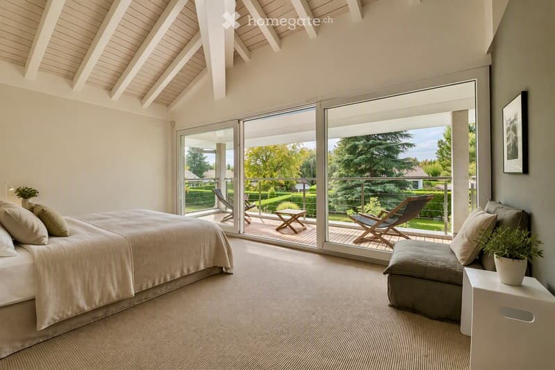 Bright bedroom with large windows and sliding glass doors leading to a balcony, featuring a bed, sofa, nightstand, and potted plants.