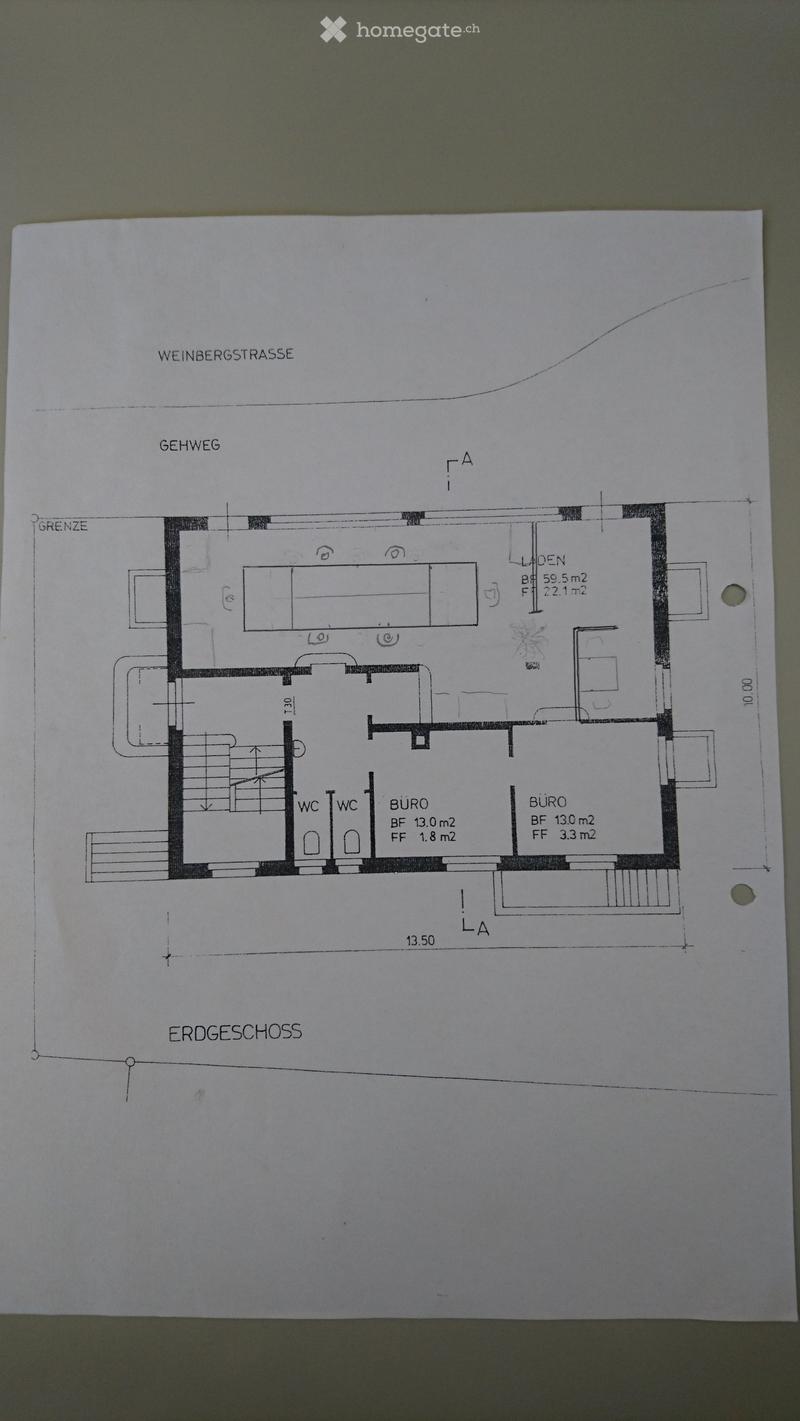 Ground floor layout showing two offices, two bathrooms, a hallway, and a storage area.