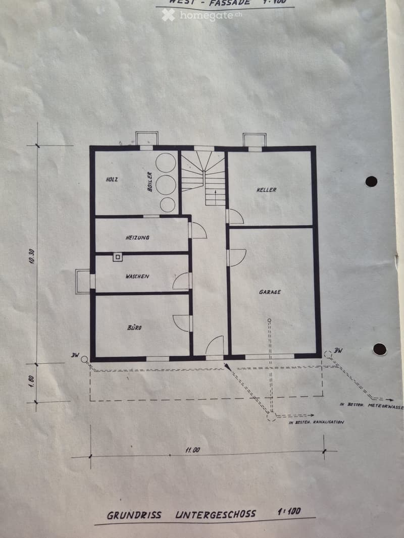 Floor plan of a basement level showing a boiler room, heating area, washing area, office, and garage.