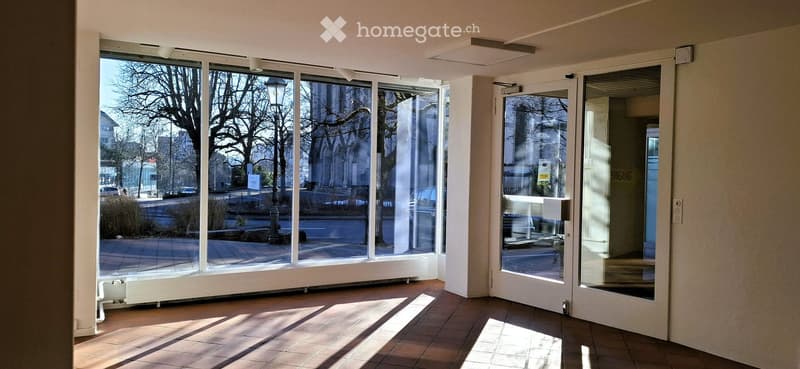 large windows, tiled floor, double entrance doors, modern lamps