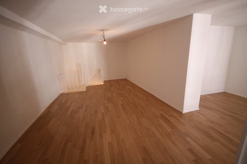 empty room, wooden floor, white walls, metal staircase