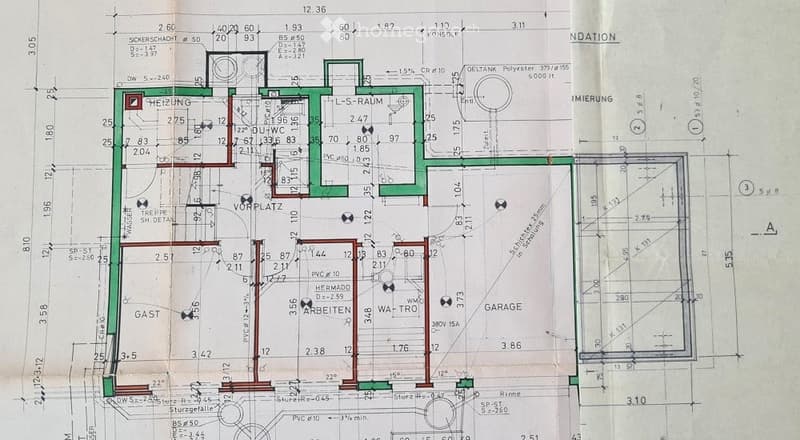 Floor plan showing a multi-room layout including a living room, dining room, kitchen, bedrooms, and a garage.