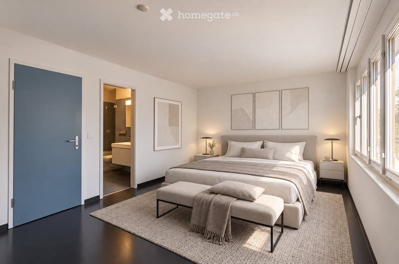 Modern bedroom with a large bed, nightstands, lamps, a bench at the foot of the bed, and framed artwork on the wall. The room features large windows and a connected bathroom.