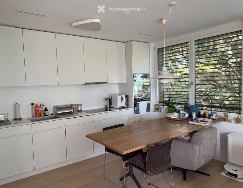 {"type": "Kitchen", "objects": ["table", "chair", "sink", "faucet", "toaster", "coffee maker", "cupboard", "bottle", "chair", "lamp", "picture frame", "plant", "cup", "bottle", "bottle", "bottle", "bottle", "bottle", "bottle", "bottle", "bottle", "bottle"
