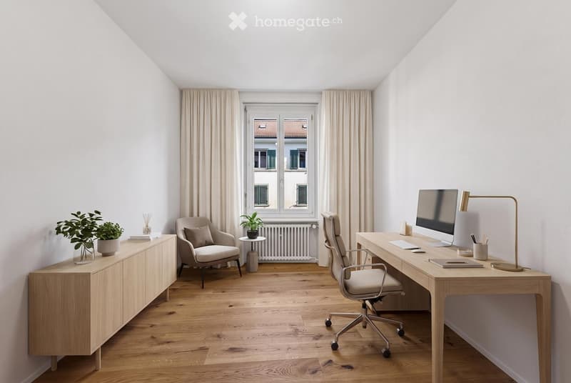Bright, minimalist room with wooden flooring, large window with view, desk with chair, lamp, screen, and small table with plant.