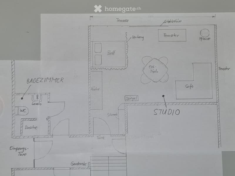 Floor plan showing a studio, kitchen, bathroom, and entrance area with labeled rooms and features.