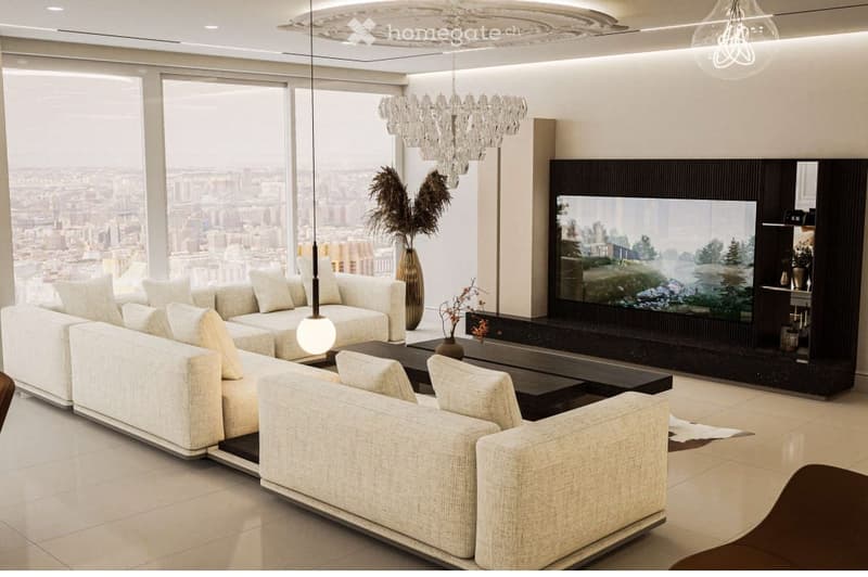 Modern living room with large windows offering a city view, a white sectional sofa, a dark coffee table, a chandelier, and a television unit.