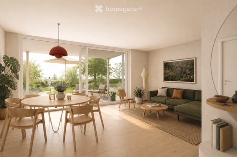 Bright, open-plan living and dining area with large windows, a green sofa, a round dining table with chairs, a pendant light, a floor lamp, and decorative plants.
