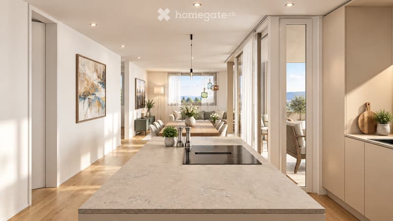 Open-plan living and dining area with a modern kitchen island, pendant lights, and large windows offering a scenic view. The space includes a sofa, dining table, chairs, and various decorative elements.