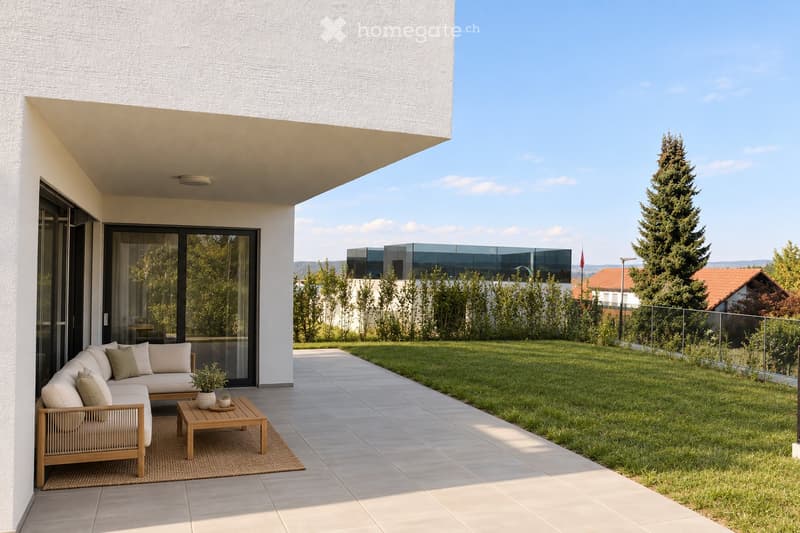 Modern outdoor patio with a white sectional sofa, wooden coffee table, wicker chair, and small potted plant, adjacent to a well-maintained lawn and modern house.