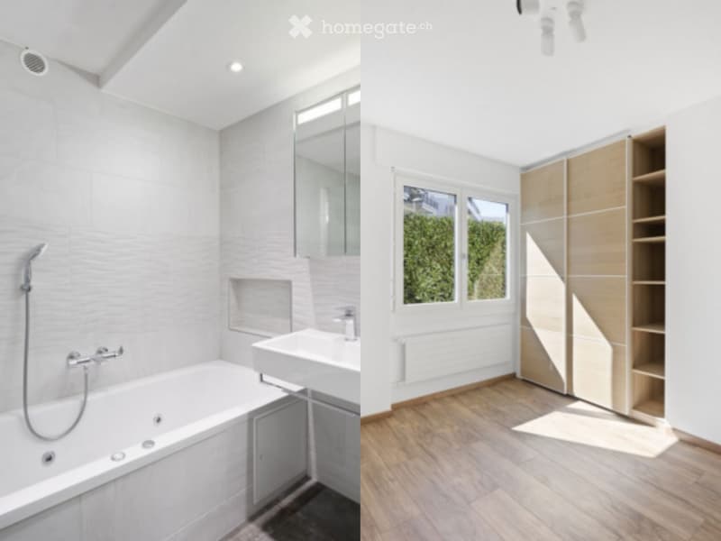 Modern bathroom with a bathtub, sink, mirror, and showerhead on the left, and a wooden cabinet with shelves on the right. The room features light-colored tiles and wooden flooring.
