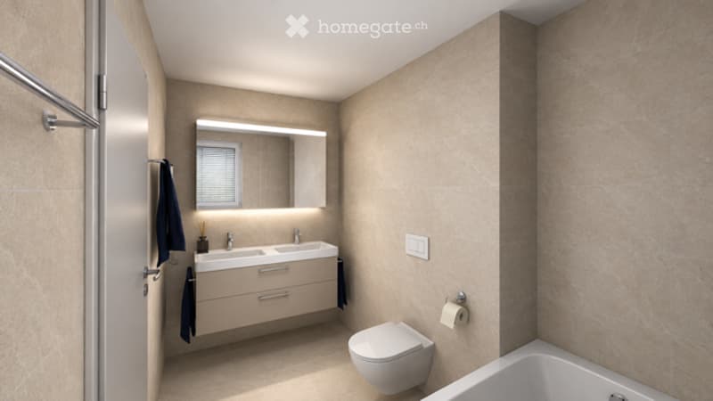 Modern bathroom with beige tiles, double sink, large mirror, toilet, bathtub, and towel hanging on the wall.