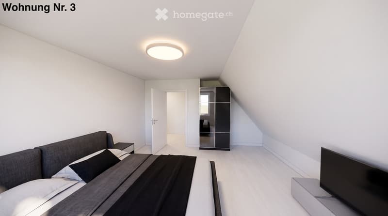 Modern bedroom with a grey sofa, nightstand, wardrobe with mirror, and television on a stand. The room features white walls, wooden flooring, and a recessed ceiling light.