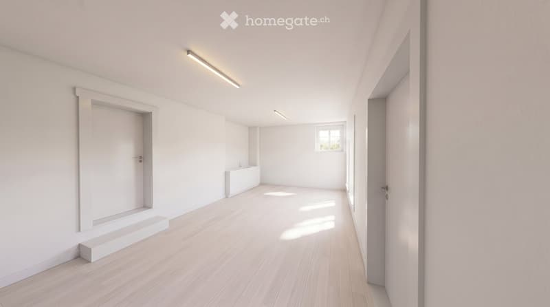 Empty room with light wooden flooring, white walls, and recessed lighting. Features a small window and a built-in bench along one wall.