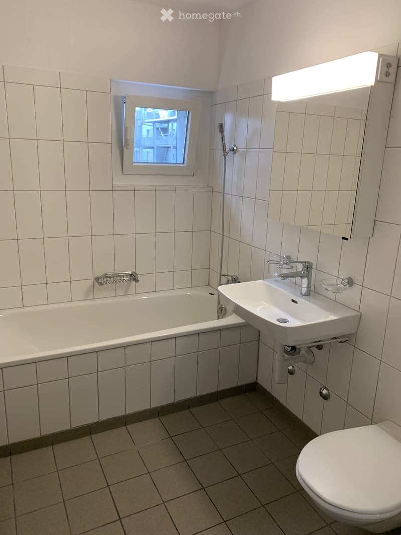 Bathroom with bathtub, sink, and toilet