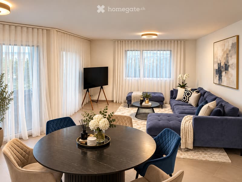Modern living room with large windows, blue sofa, ottoman, coffee table, dining table, chairs, and decorative vases.