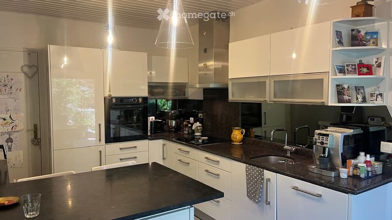 {"type": "Kitchen", "objects": ["refrigerator", "oven", "coffee maker", "sink", "faucet", "cup", "plate", "cupboard", "faucet", "faucet", "cupboard", "cupboard", "cupboard", "cupboard", "cupboard", "cupboard", "cupboard", "cupboard", "cupboard", "cupboard