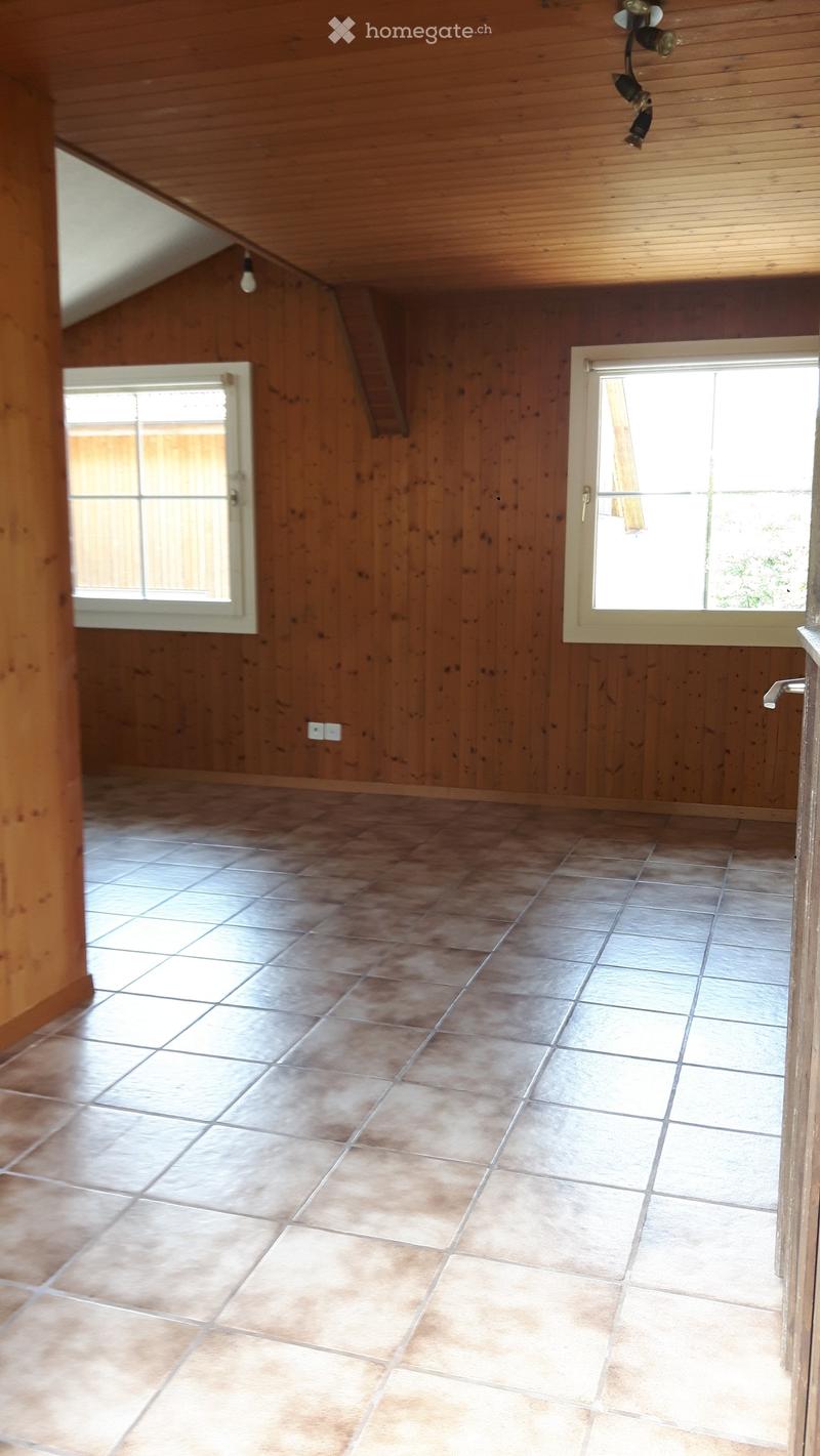 empty room, wooden walls, tiled floor, two windows, ceiling lights