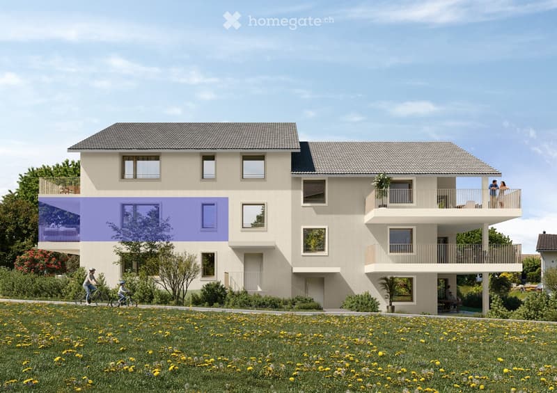Two-story modern building with beige facade, multiple windows, balconies, and a grassy area in front.