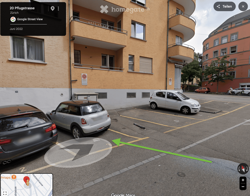 Multi-story residential building with balconies, parked cars in front, and a street view interface overlay.