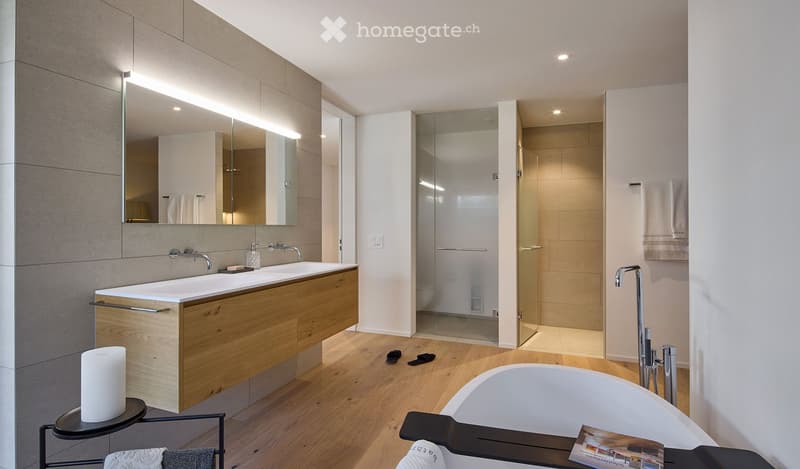 white bathtub, double sink vanity, large mirror, modern fixtures