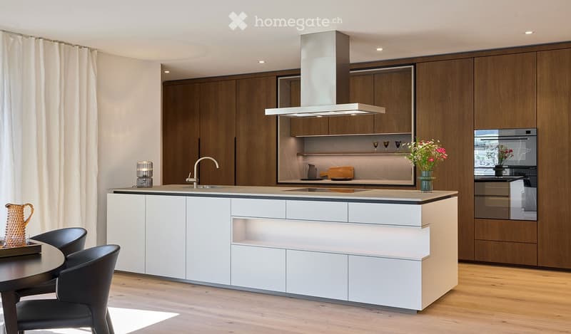 white modern kitchen, wooden cabinets, gray countertops, wooden floor, island with sink, stainless steel appliances