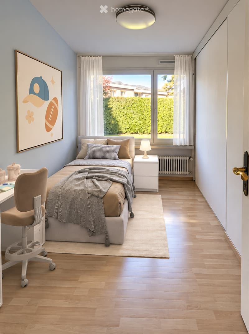 Cozy bedroom with a bed, nightstand, desk, chair, and a large window with white curtains. The room features light blue walls, wooden flooring, and a decorative picture frame on the wall.