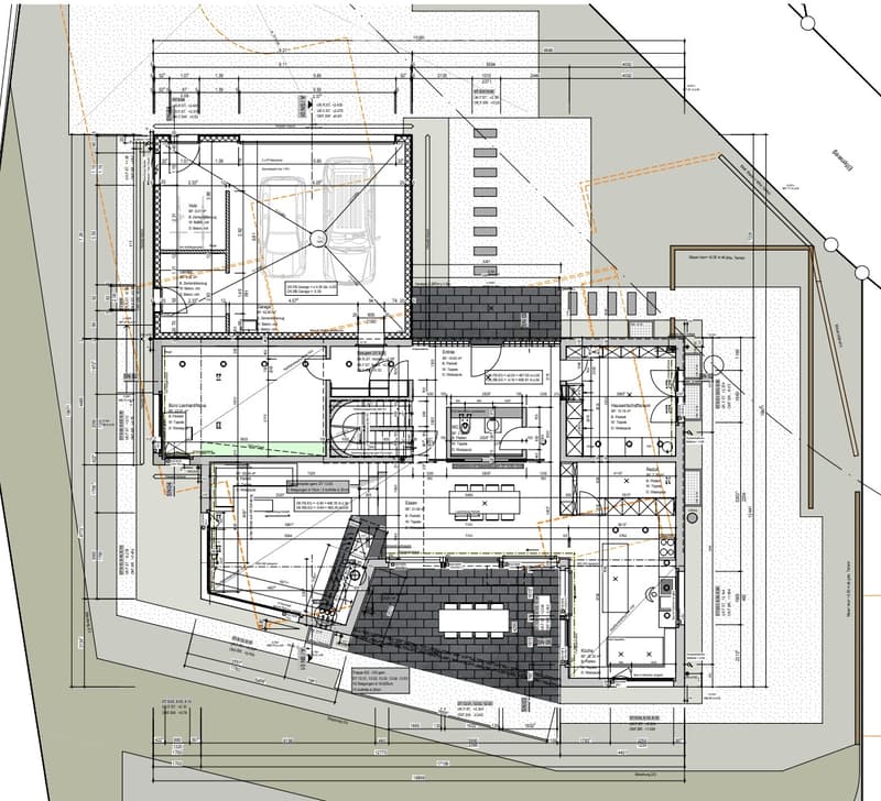 Floor plan of a commercial building with multiple rooms, including a garage, offices, and parking areas.