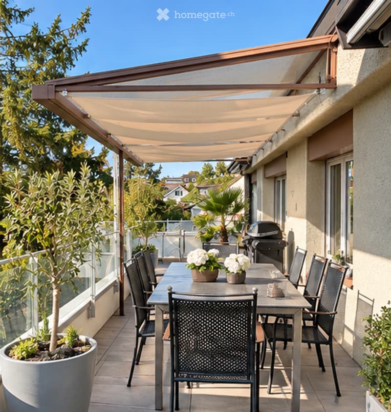 A modern outdoor terrace with a retractable awning, a dining table with chairs, potted plants, and a grill.