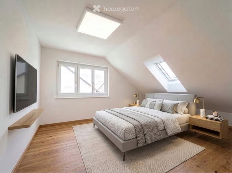 Modern attic bedroom with wooden floors, large windows, skylights, a grey upholstered bed, nightstands, table lamps, and a wall-mounted screen.