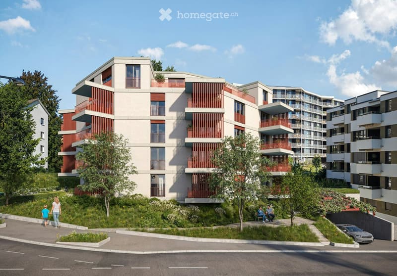 Modern multi-story residential building with balconies, surrounded by greenery and a paved walkway.