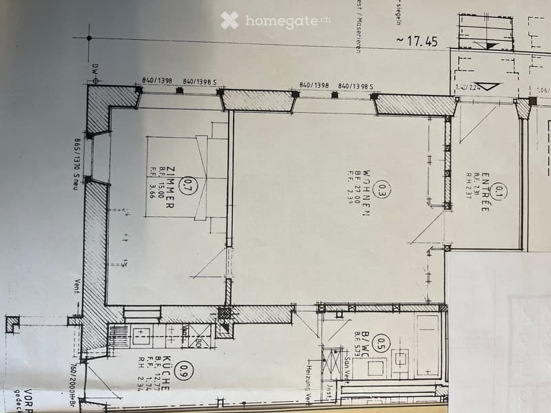 Floor plan showing a kitchen, living room, two bedrooms, and an entrance area with labeled dimensions and room labels.